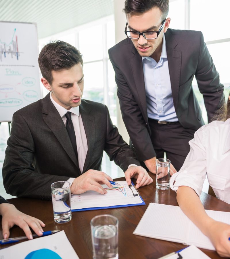 Business people sitting in meeting room.